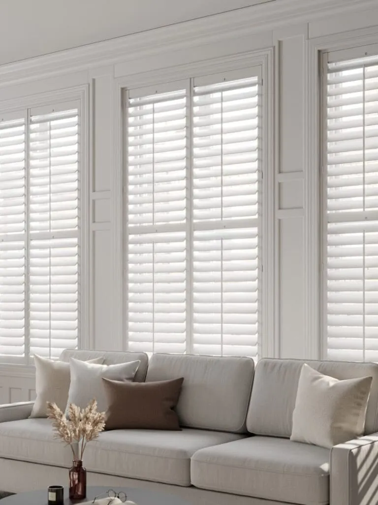 Full-height shutters framing a bay window